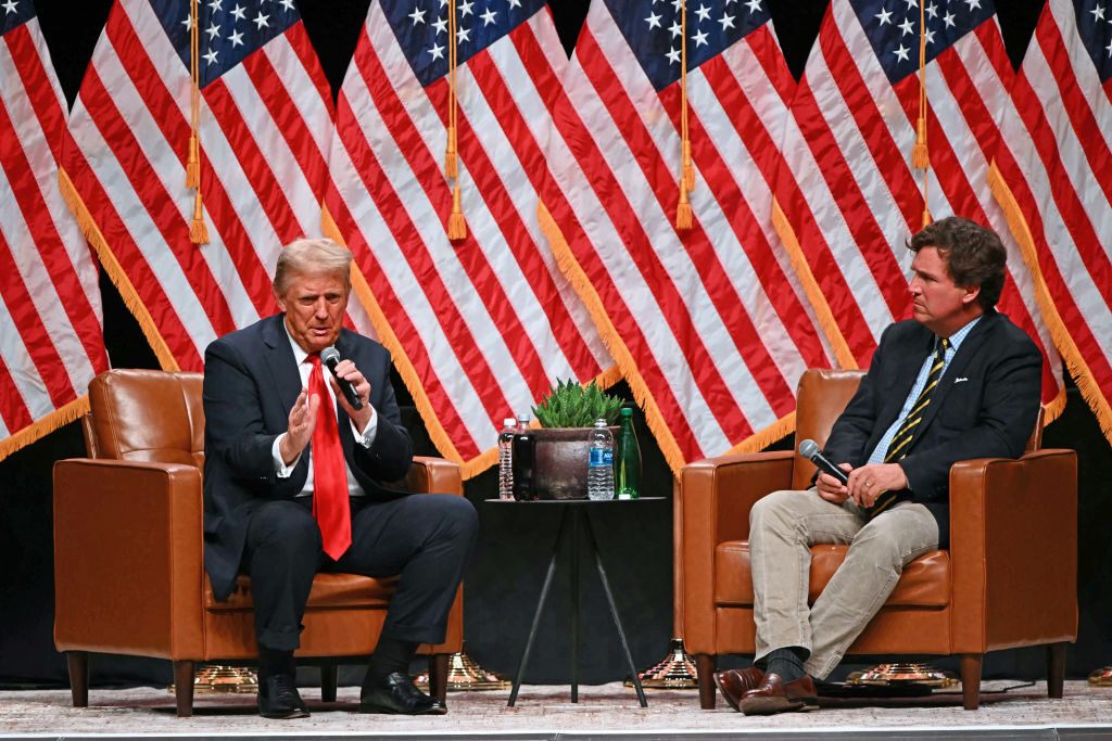 Former President Donald Trump speaks during an event with conservative commentator Tucker Carlson on Thursday night in Glendale, Ariz. (Patrick T. Fallon/AFP via Getty Images)