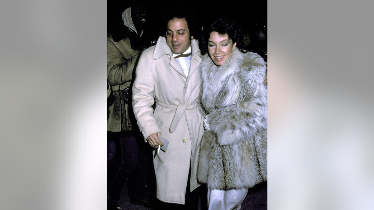 Billy Joel with Elizabeth Weber at an event