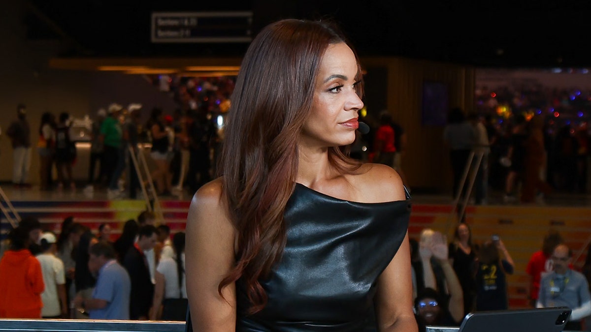 Elle Duncan looks on