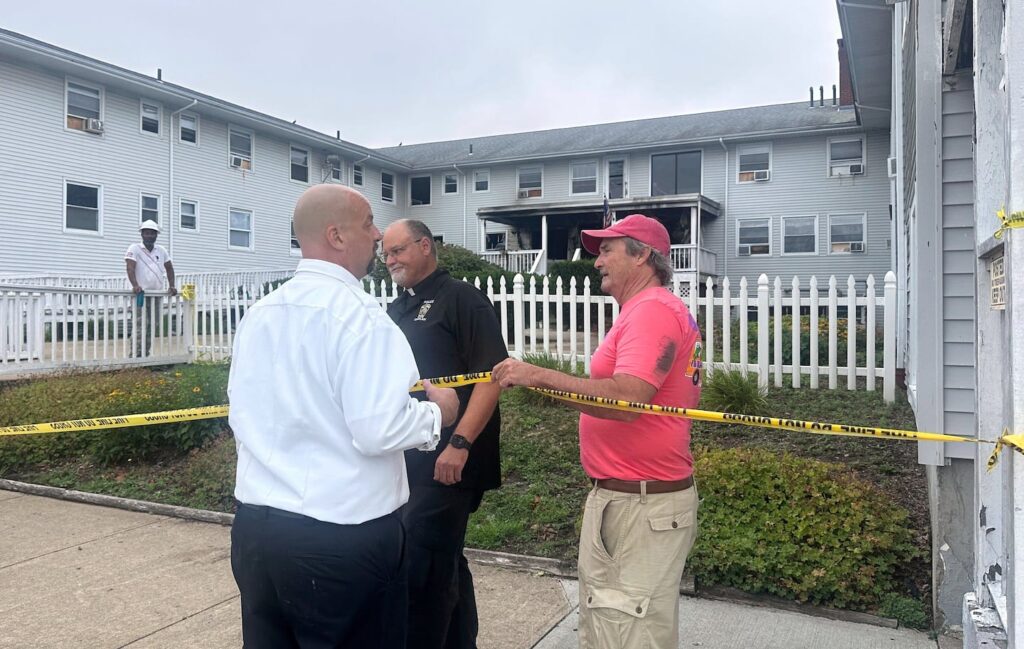 Dennis Etzkorn, owner of Gabriel House (right), visited the site in the aftermath of a fire alongside Fall River fire Chief Jeffrey Bacon (left), on Monday.