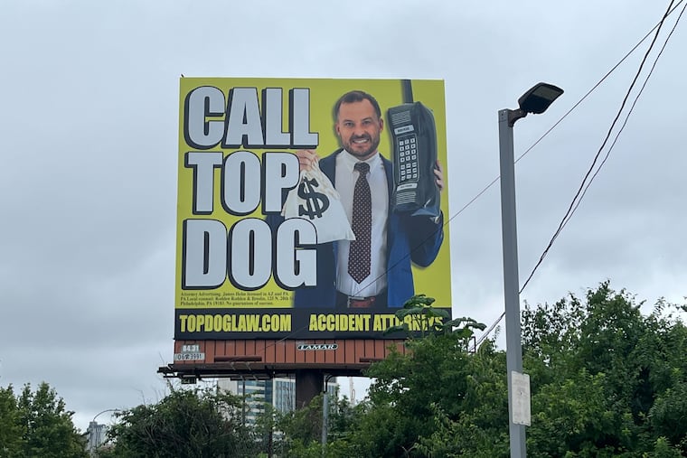 A TopDog Law billboard on S. 34th Street in Philadelphia.