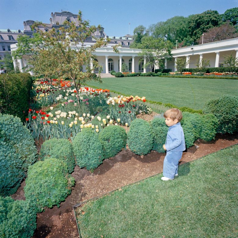 John F. Kennedy, Jr., stands in the Rose Garden of the White House in April 1963.
