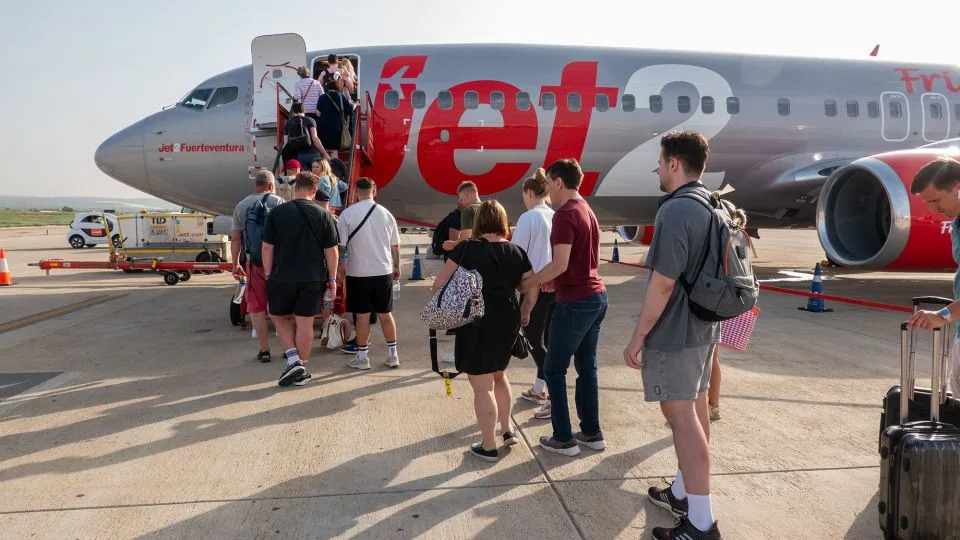 As soon as they board a Jet2 flight, passengers are bombarded by the track 