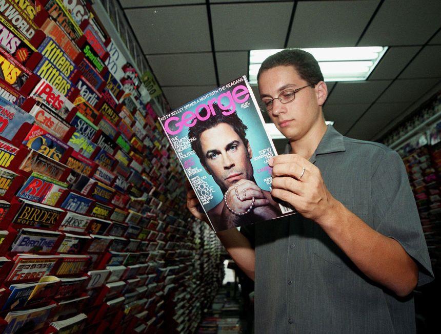 An NYU student with the September 1999 issue of George magazine, with Rob Lowe on the cover. This was the last issue with JFK Jr. as editor.