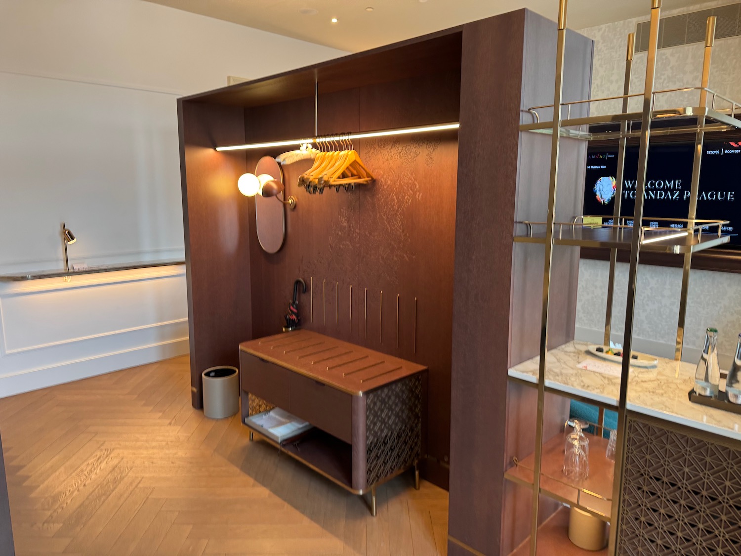 a room with a mirror and a shelf