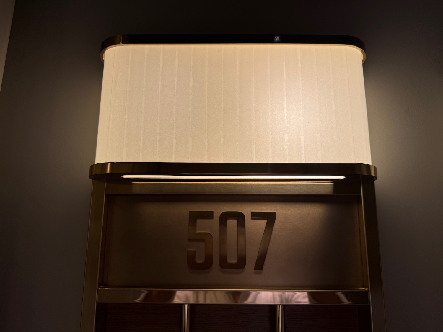a light fixture with a white shade