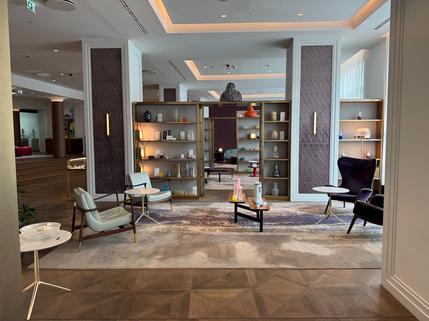 a room with a large wall and shelves