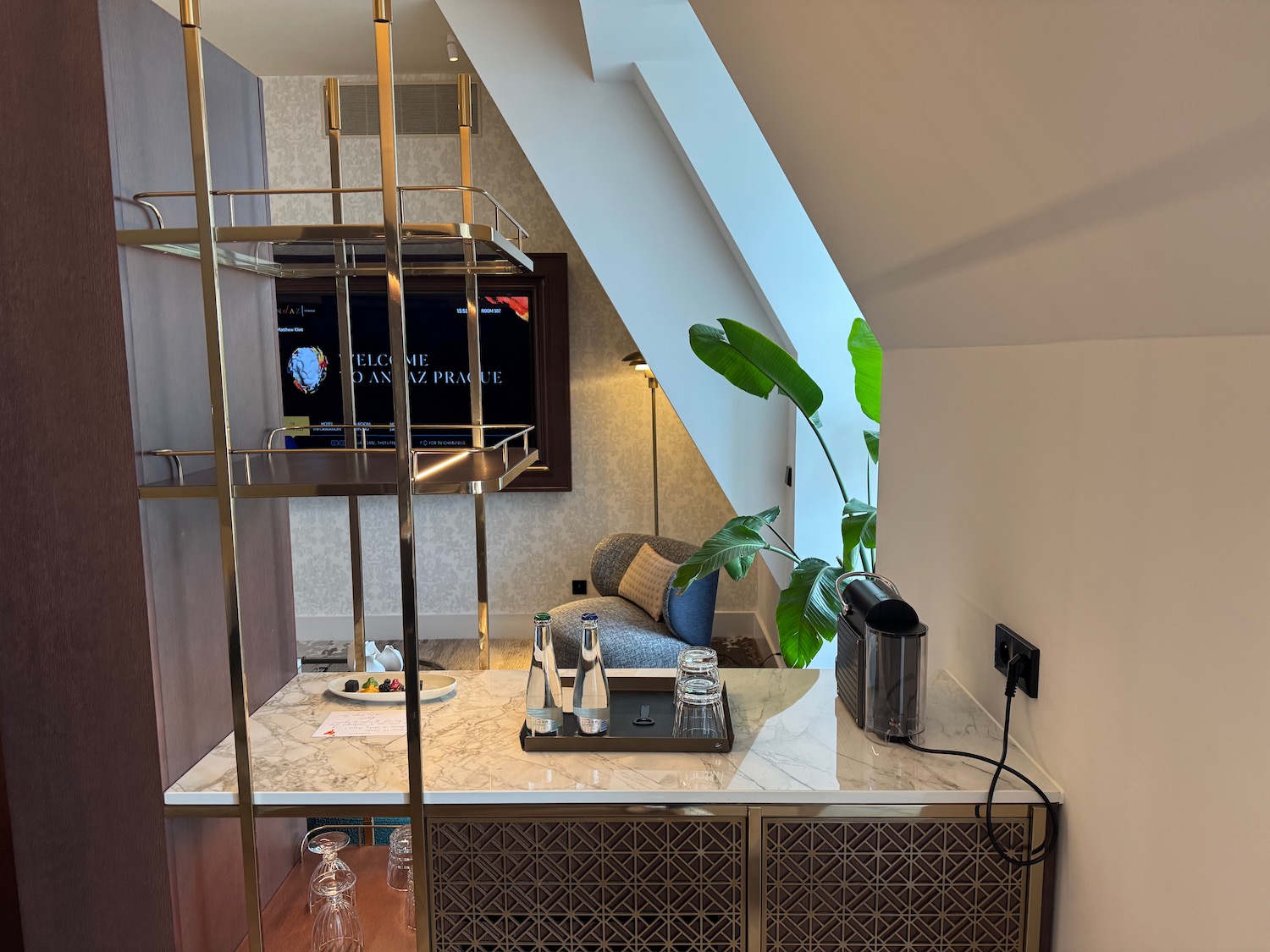 a room with a tv and a bar