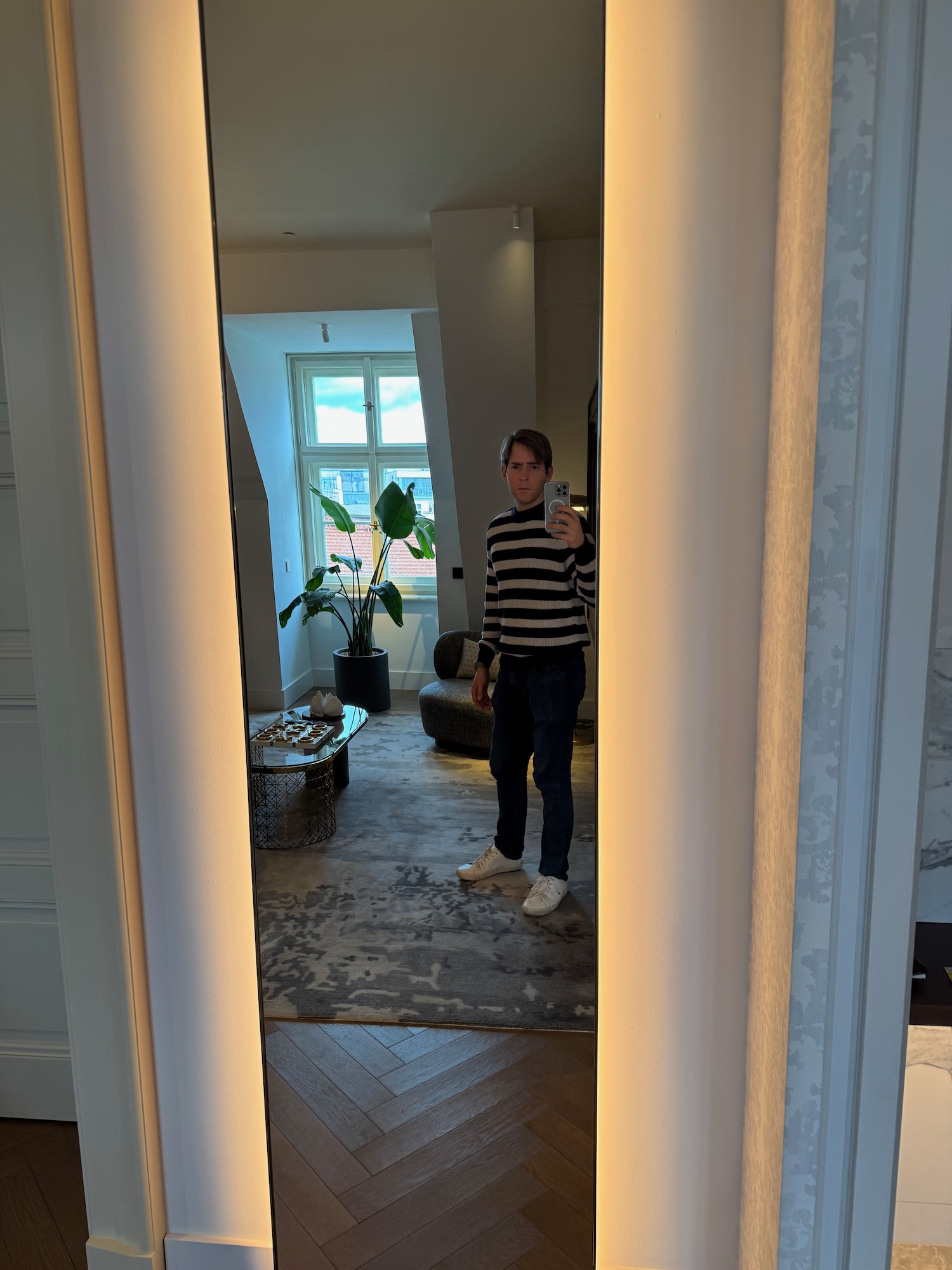a man taking a selfie in a mirror