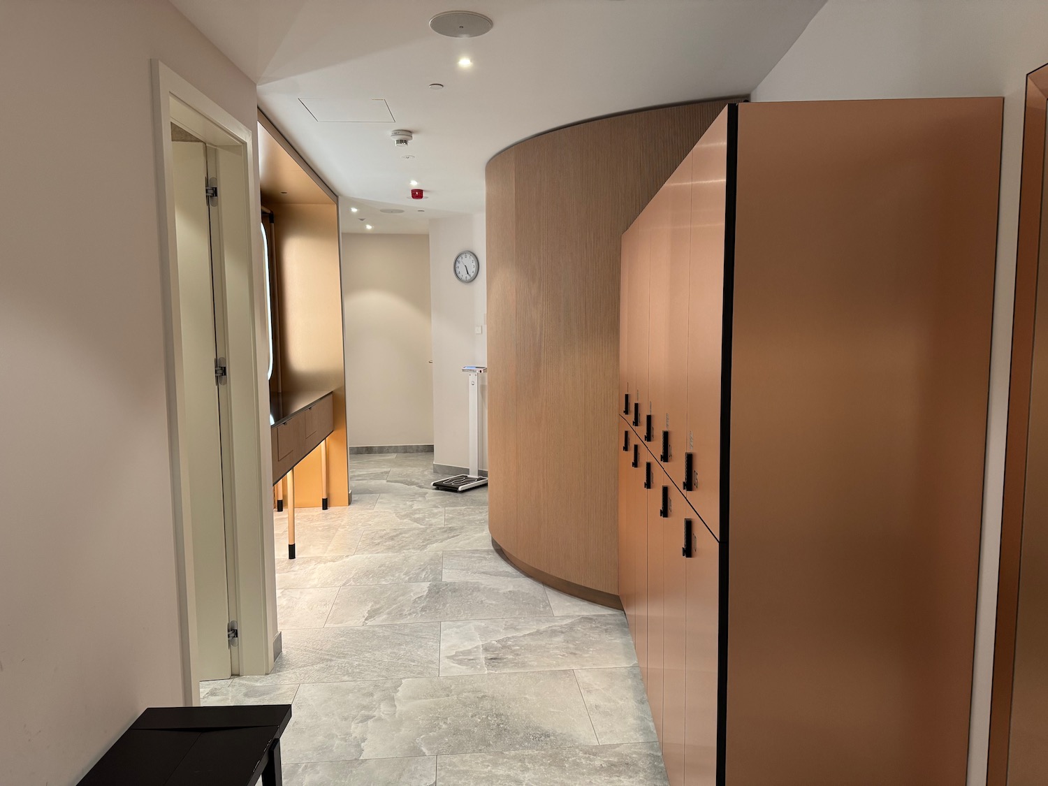 a hallway with a large wooden cabinet