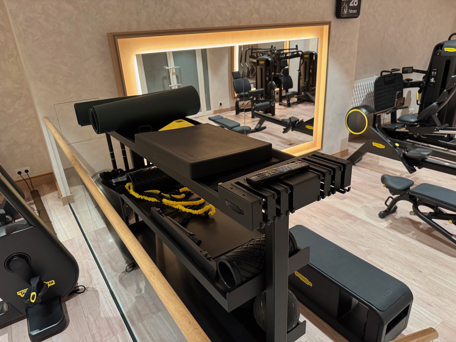 a mirror in a room with exercise equipment