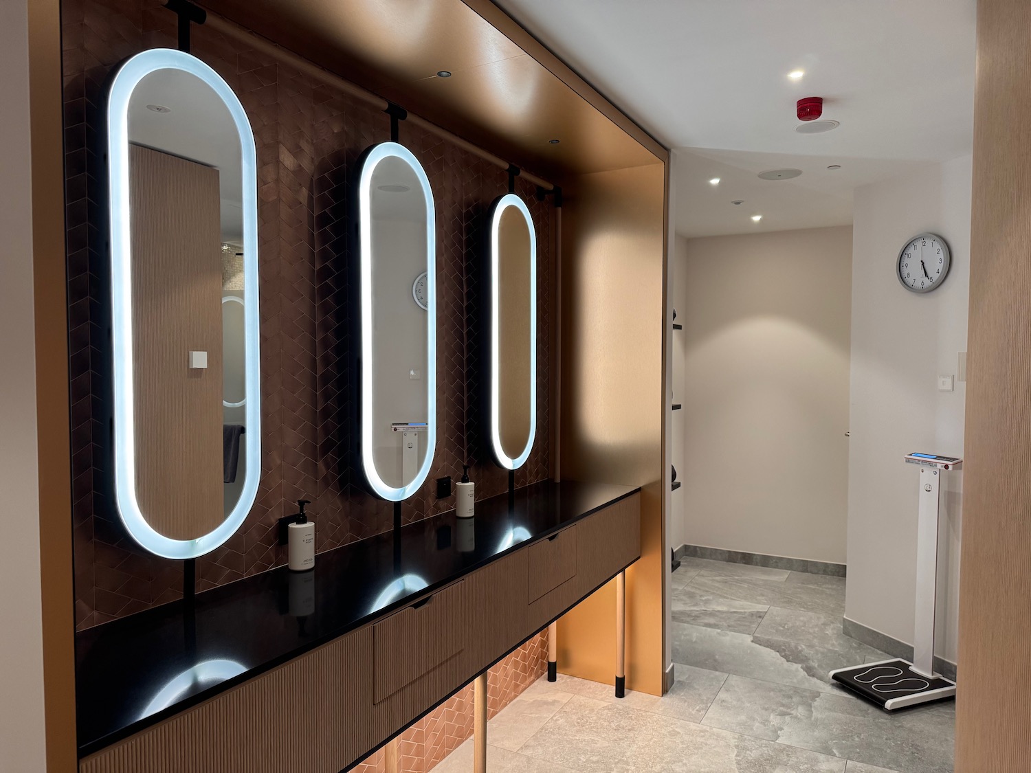 a bathroom with a mirror and a sink