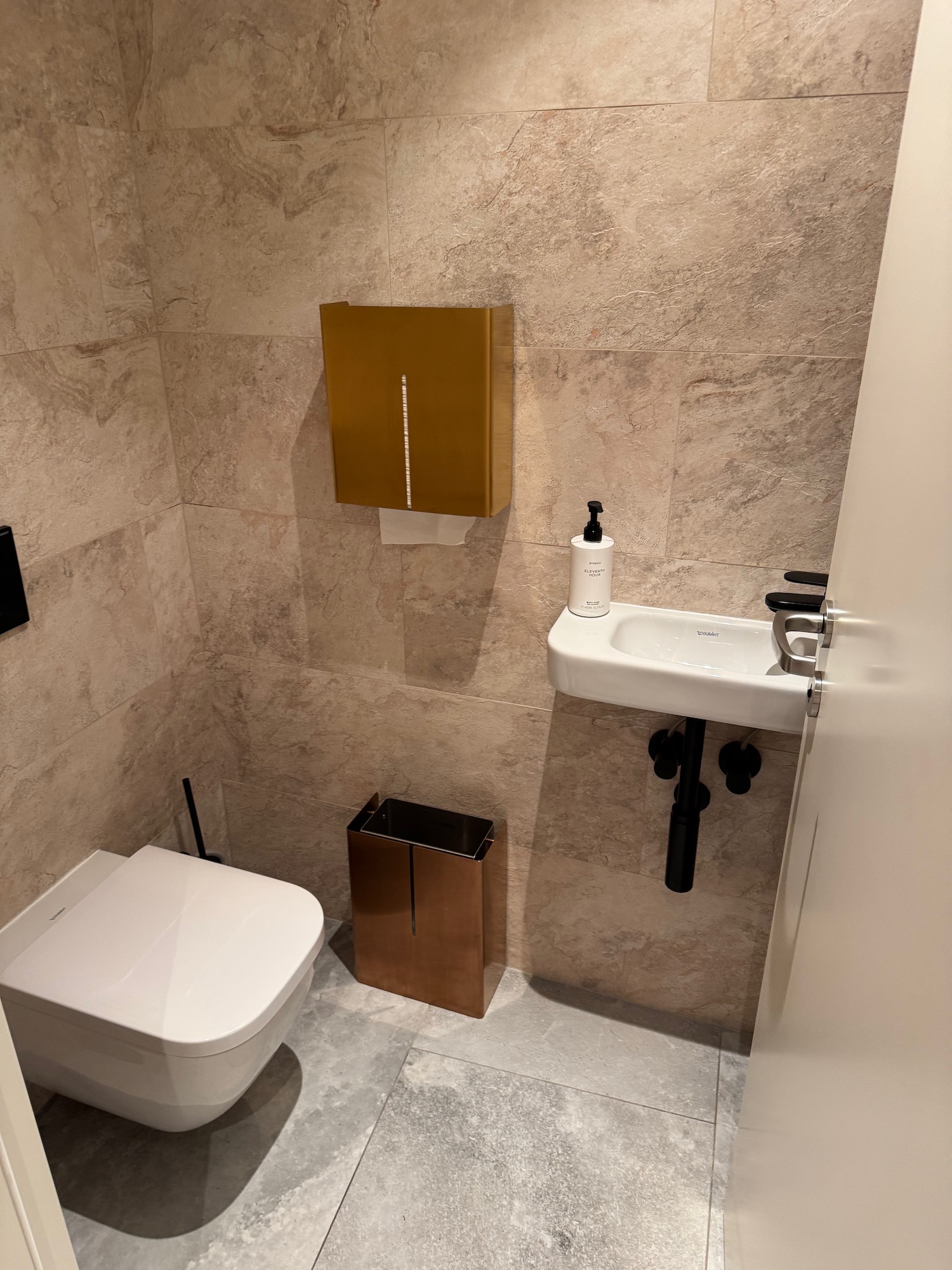 a bathroom with a sink and toilet