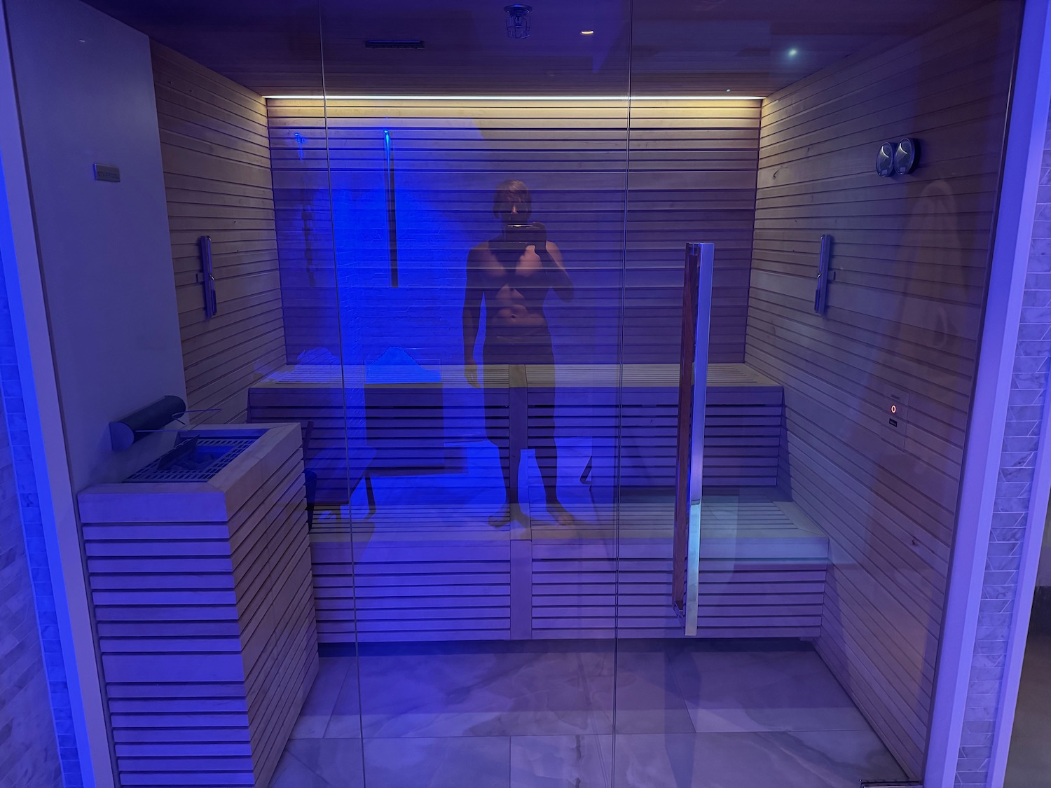 a person standing in a sauna