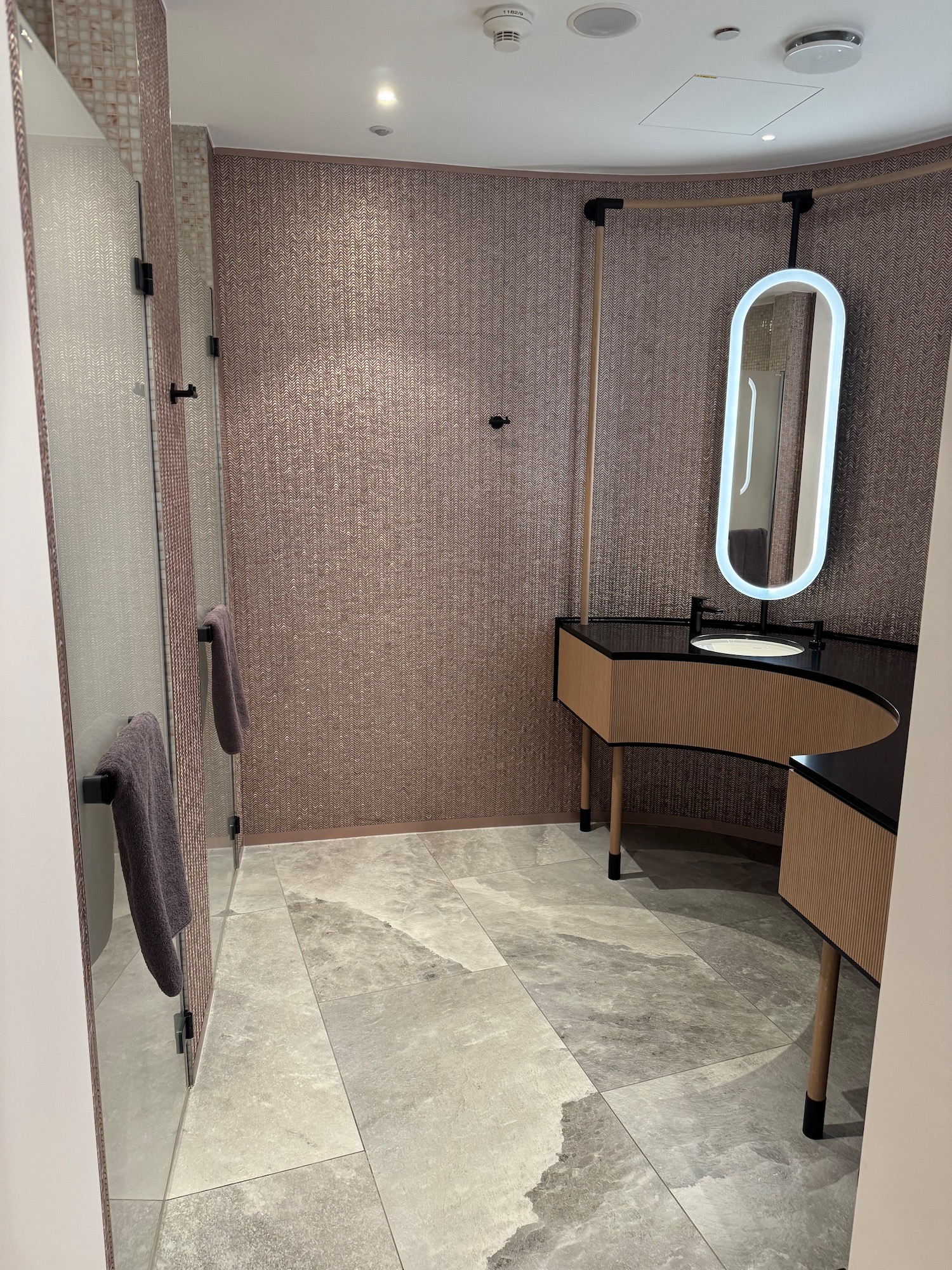 a bathroom with a mirror and a sink