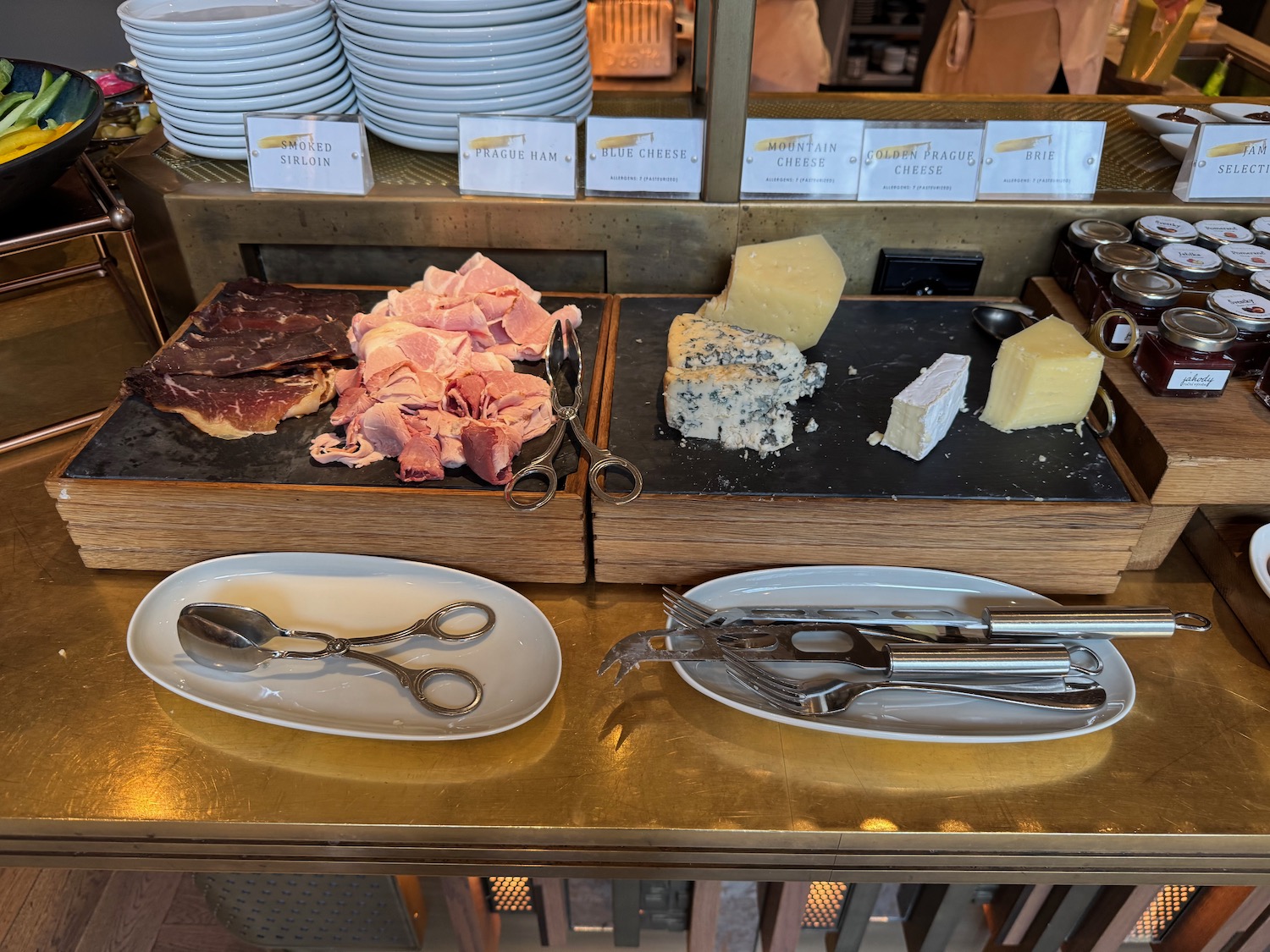 a table with plates of food and utensils
