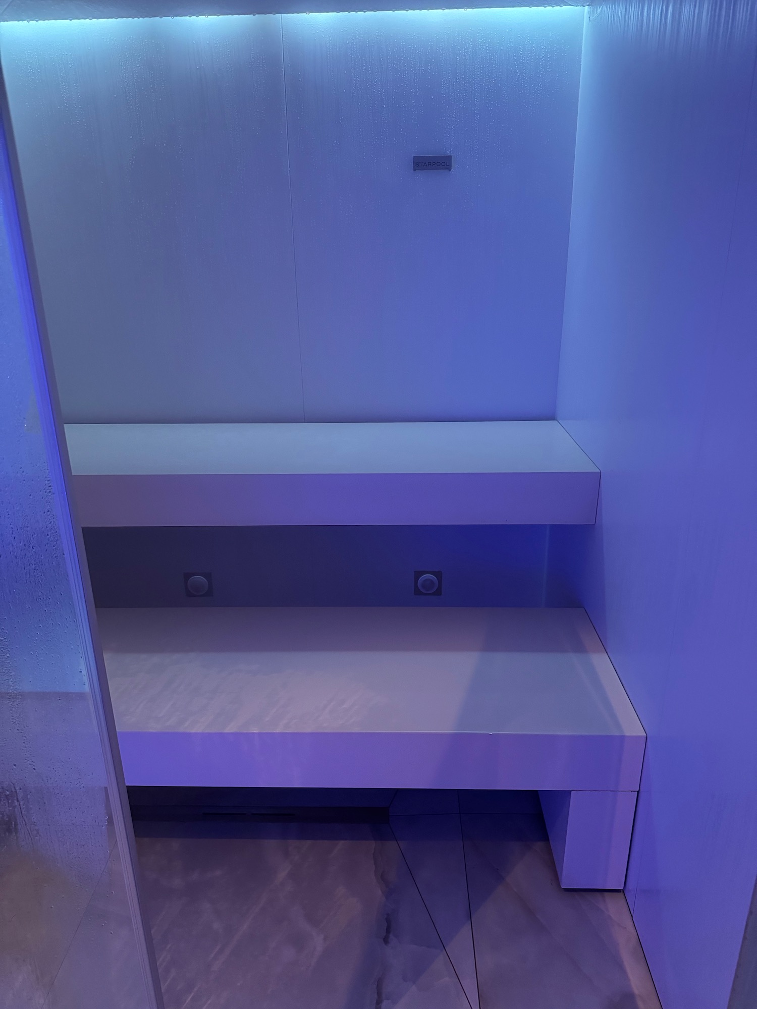 a white bench in a room