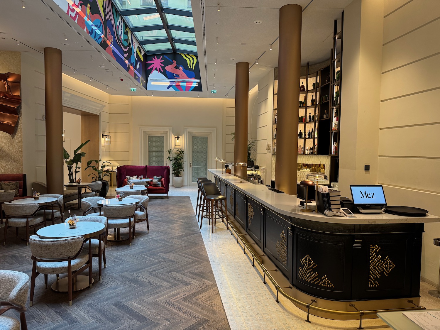 a room with a bar and chairs