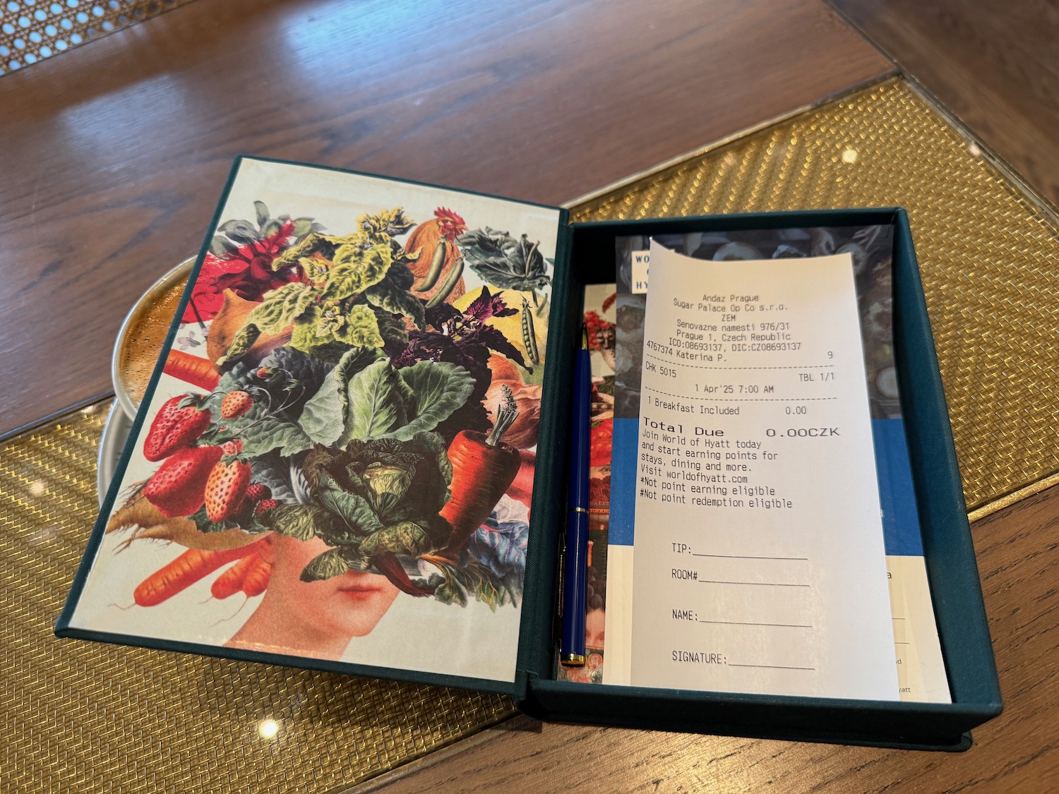 a box with a receipt and a pen on it