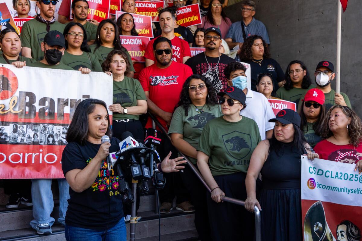 Teacher Lizette Becerra speaks at a rally