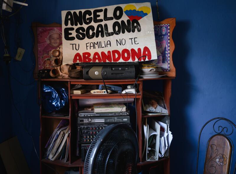 A hand-drawn poster on a rack with items on different shelves