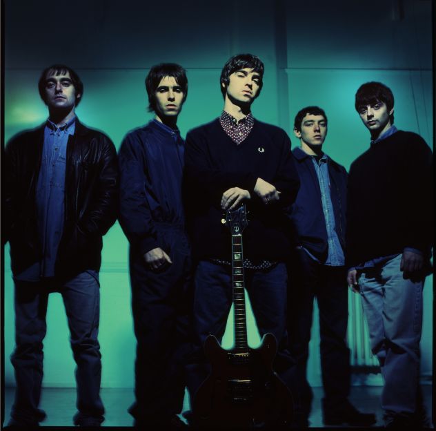 A portrait of the early Oasis line-up, taken in 1993 at Manchester's Nomad Studios. The three surviving members -- Paul Arthurs, better known as Bonehead, plus Liam and Noel Gallagher, are on the left. Tony McCarroll (second right) and Paul McGuigan (far right) left the group later in the 1990s.