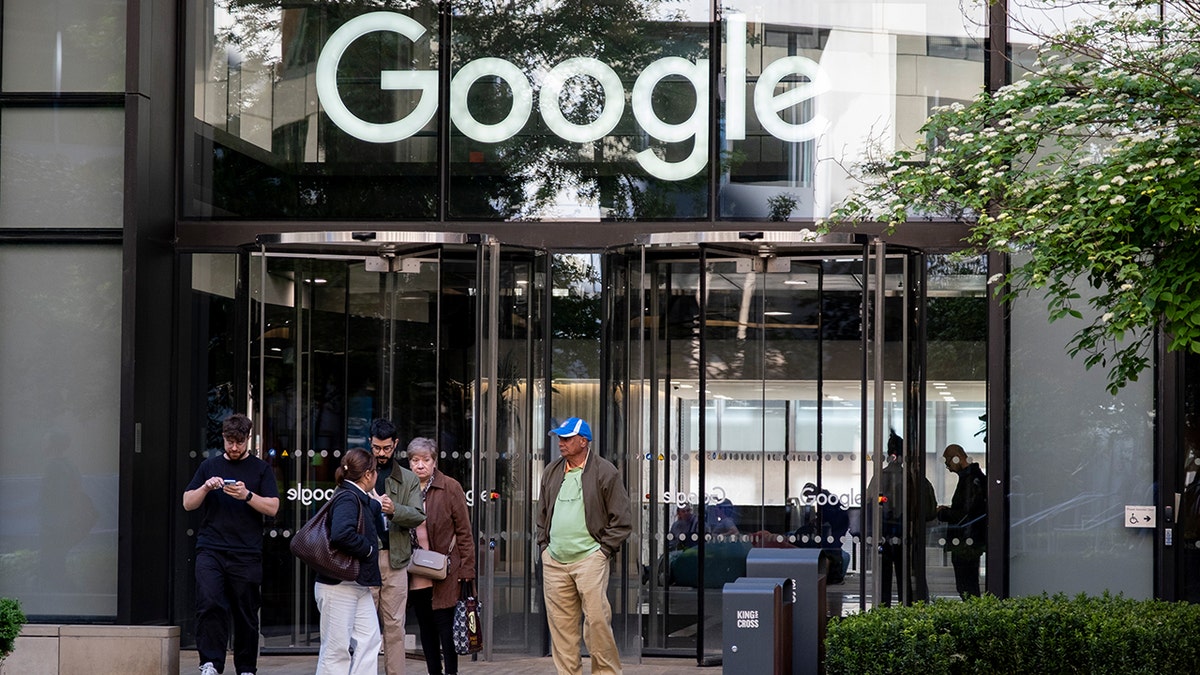 entrance of google office building with people standing outside