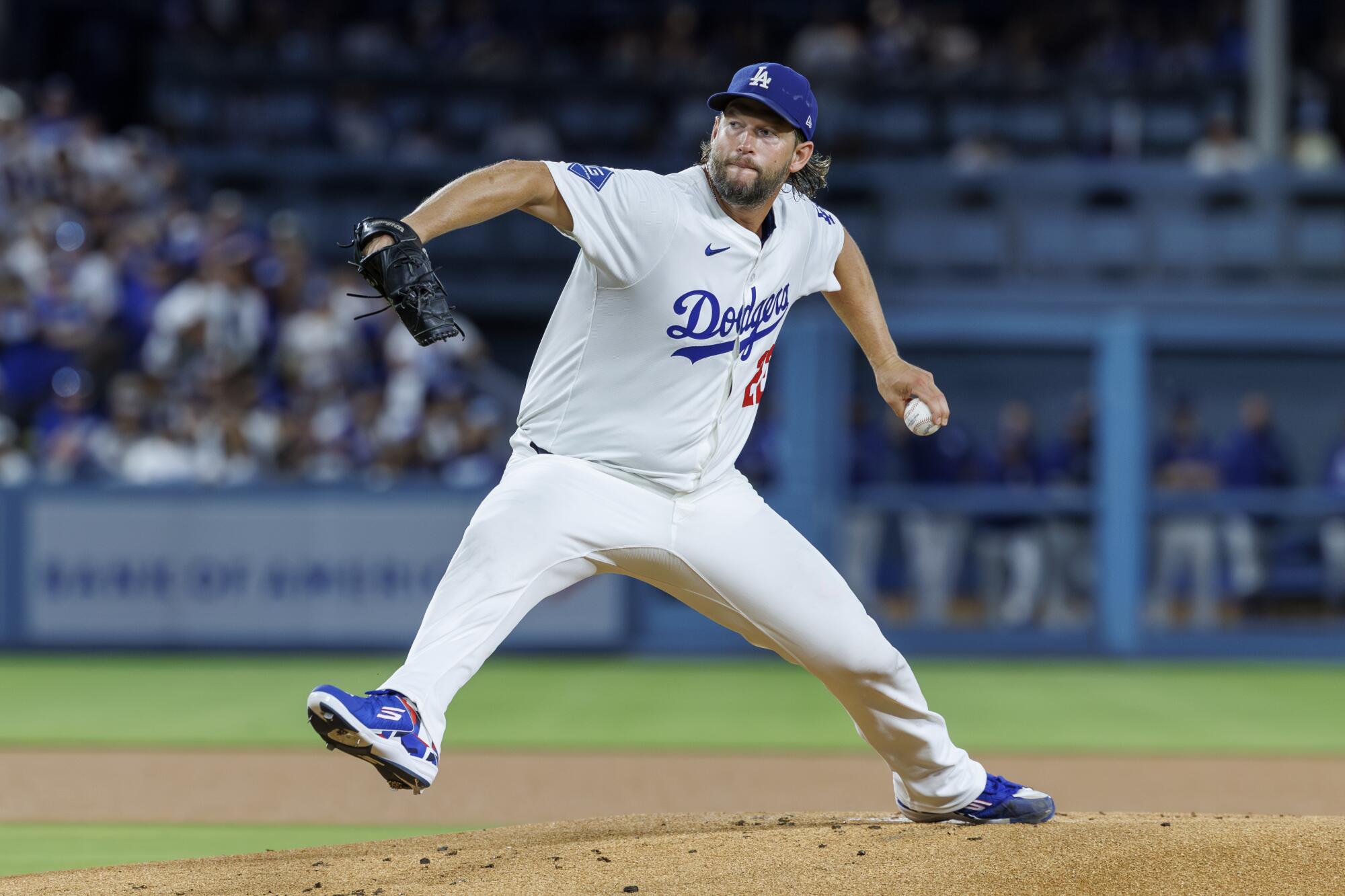 Dodgers pitcher Clayton Kershaw delivers against the Giants on Friday night.