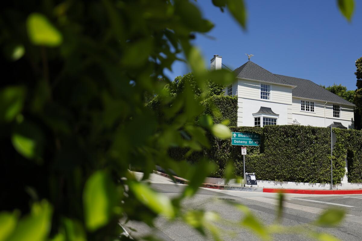 Neighborhood with a big house and greenery.