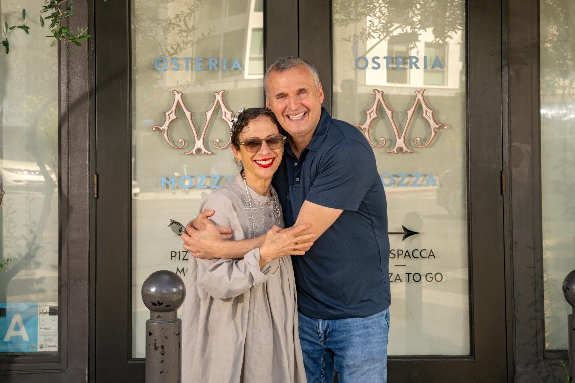 Chef Nancy Silverton and Phil Rosenthal in front of Osteria Mozza.