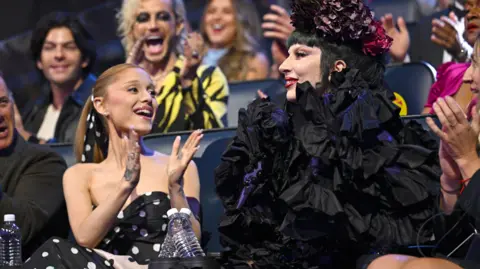 Getty Images Ariana Grande applauding Lady Gaga
