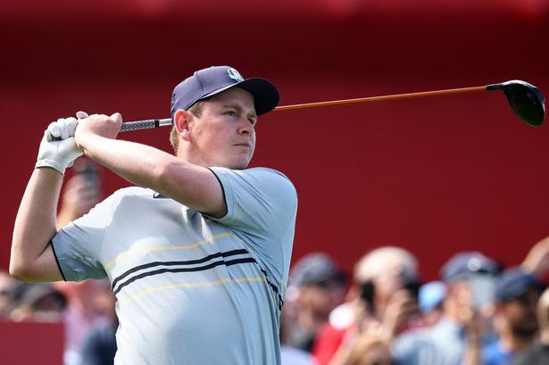 Robert MacIntyre of Team Europe plays his shot from the 15th tee