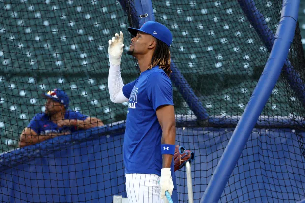 Cubs outfielder Kevin Alcántara takes batting practice at Wrigley Field...