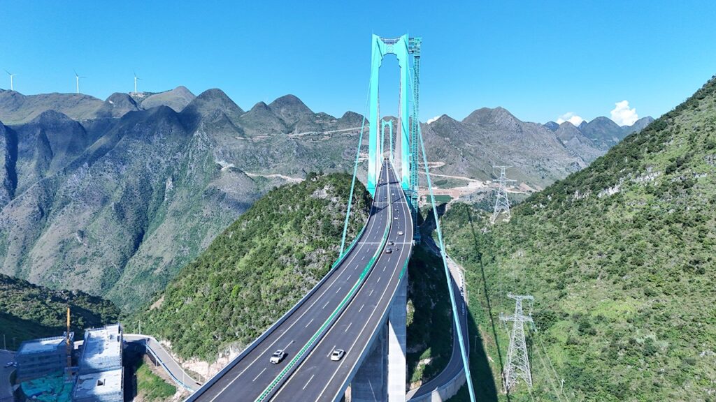 China opens world's reported largest span bridge over Beipan River valley to traffic