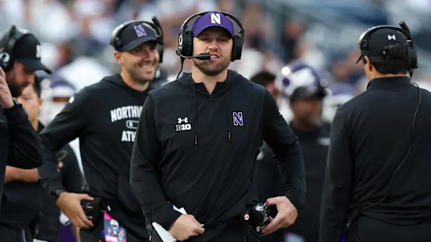 Northwestern Wildcats head coach David Braun walks on the sideline during the fourth quarter 