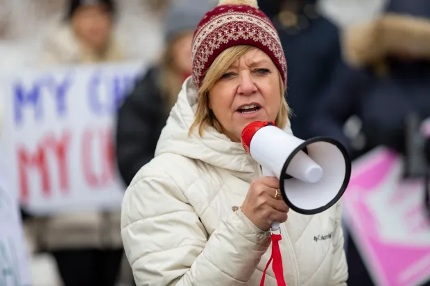 Former Illinois State Rep. Jeanne Ives speaks at a protest against mask mandates in schools on Feb. 7, 2022, outside the D181 Administration Center in Clarendon Hills. (Brian Cassella/Chicago Tribune)