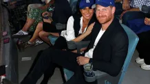 LOS ANGELES, CA - OCTOBER 28:  Prince Harry, Duke of Sussex and Meghan, Duchess of Sussex pose for a photo during Game Four of the 2025 World Series presented by Capital One between the Toronto Blue Jays and the Los Angeles Dodgers at Dodger Stadium on Tuesday, October 28, 2025 in Los Angeles, California. (Photo by Joe Scarnici/MLB Photos via Getty Images)