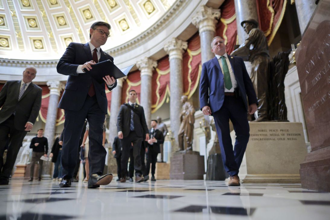 House Speaker Mike Johnson walks through Statuary Hall on his way to a news conference on the 29th day of the federal government shutdown at the Capitol on Wednesday in Washington, DC.