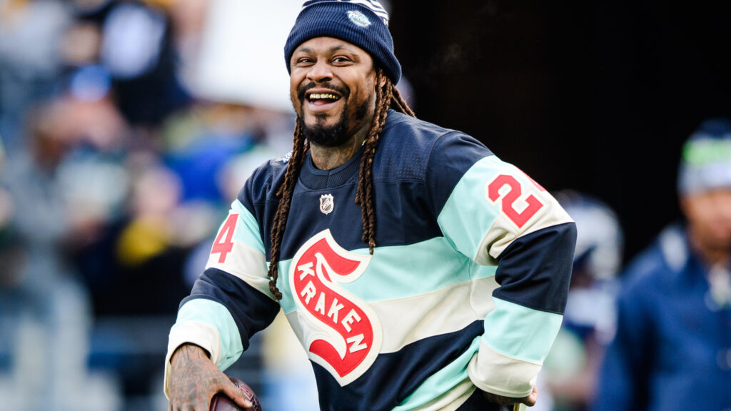 Former Seattle Seahawk Marshawn Lynch looks on before the game against the Pittsburgh Steelers at Lumen Field on December 31, 2023 in Seattle, Washington.