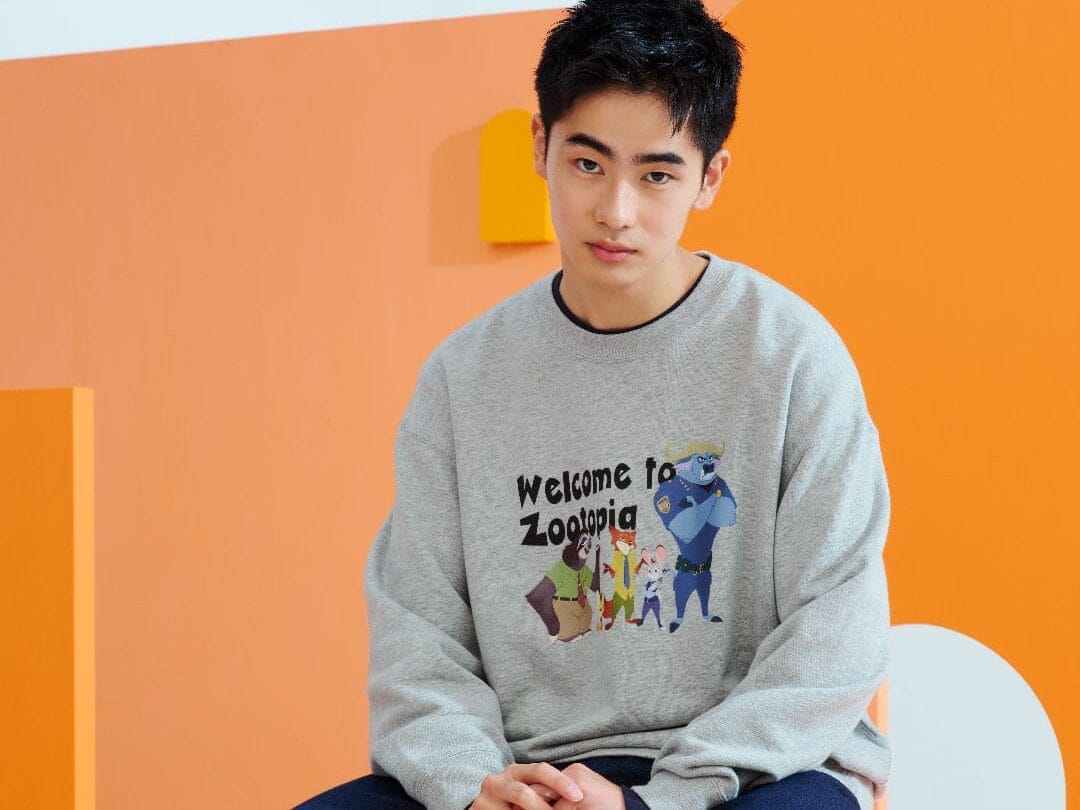 A young man in a grey Disney Store 