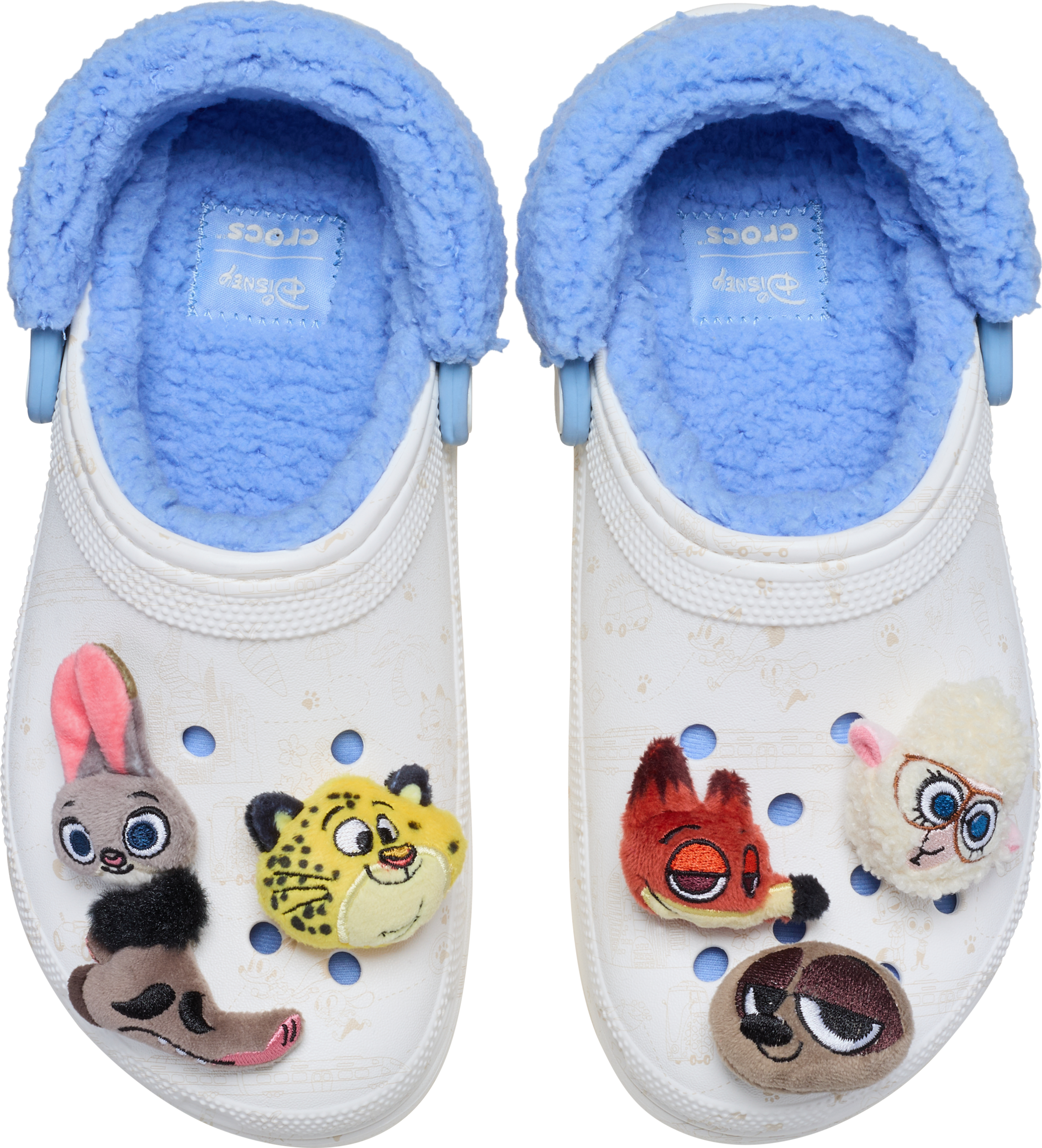 White Crocs with blue fleece lining, Zootopia 2 charms on the toes—perfect for a stroll in any Disney park, castle or not!