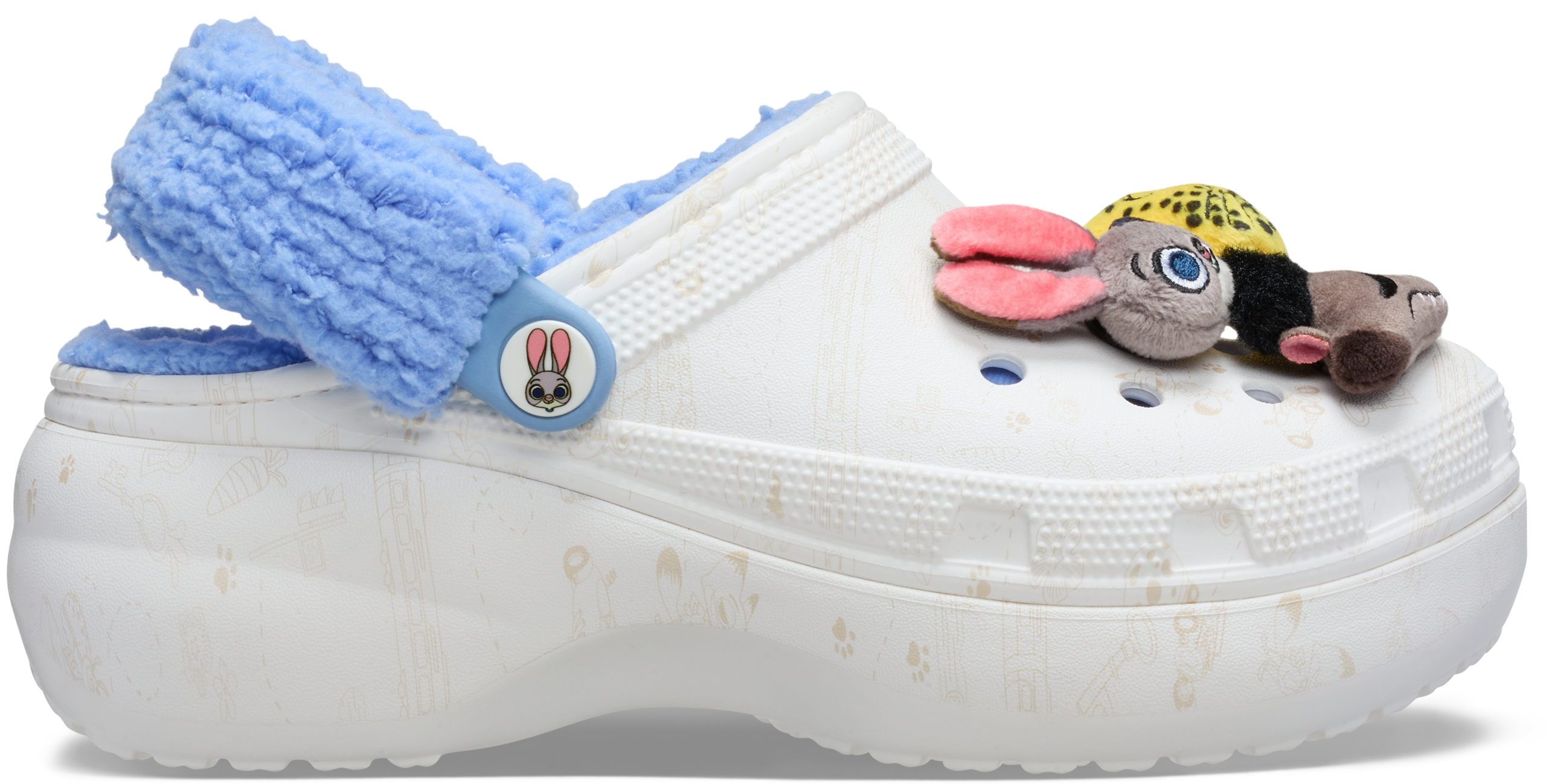 White Croc shoe with blue fuzzy lining, Zootopia 2 charms; exclusive Disney Parks merchandise, no castle shown for comparison.