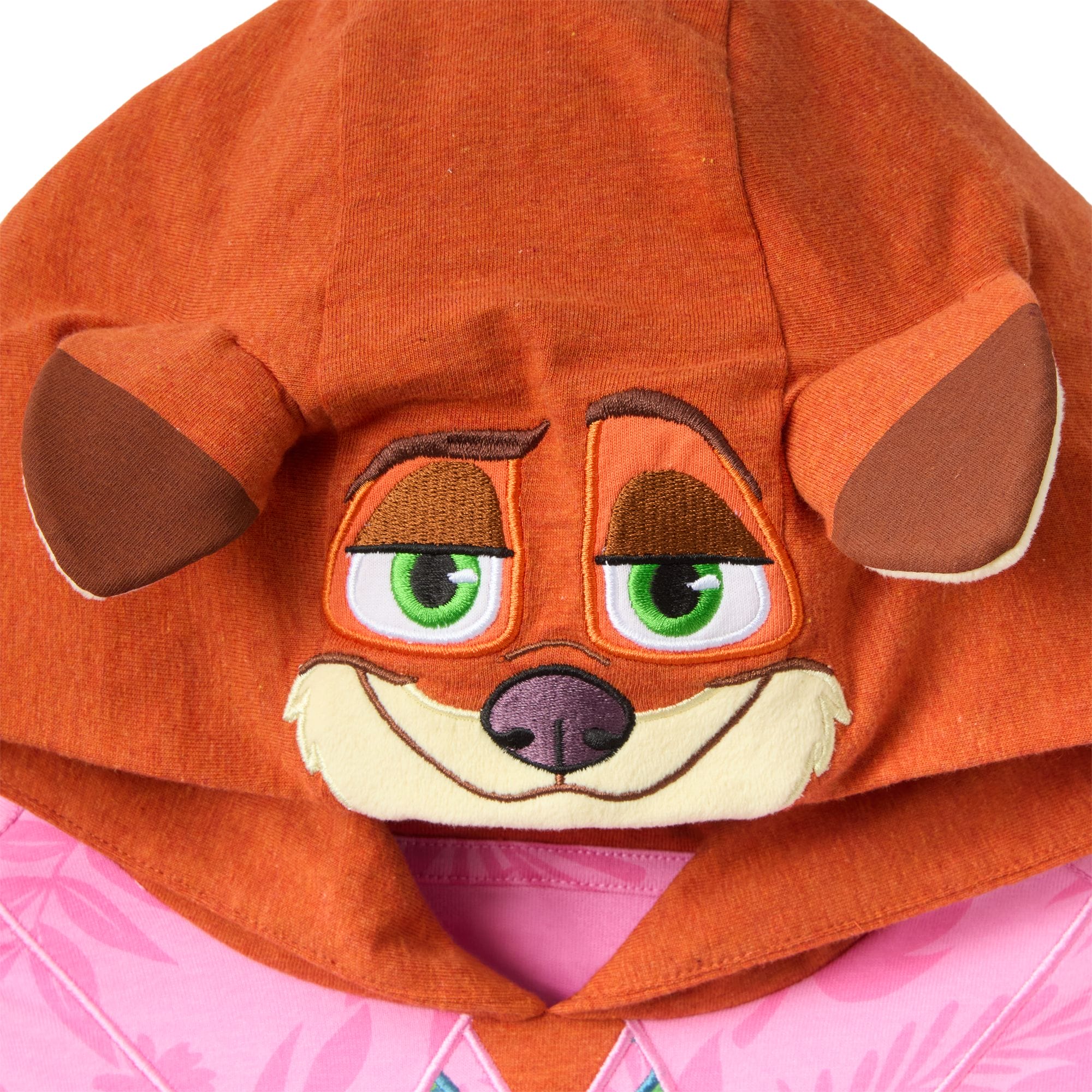 A pink hooded garment with a cartoon fox face, green eyes, brown ears—resembling Zootopia 2 Disney Parks merchandise.