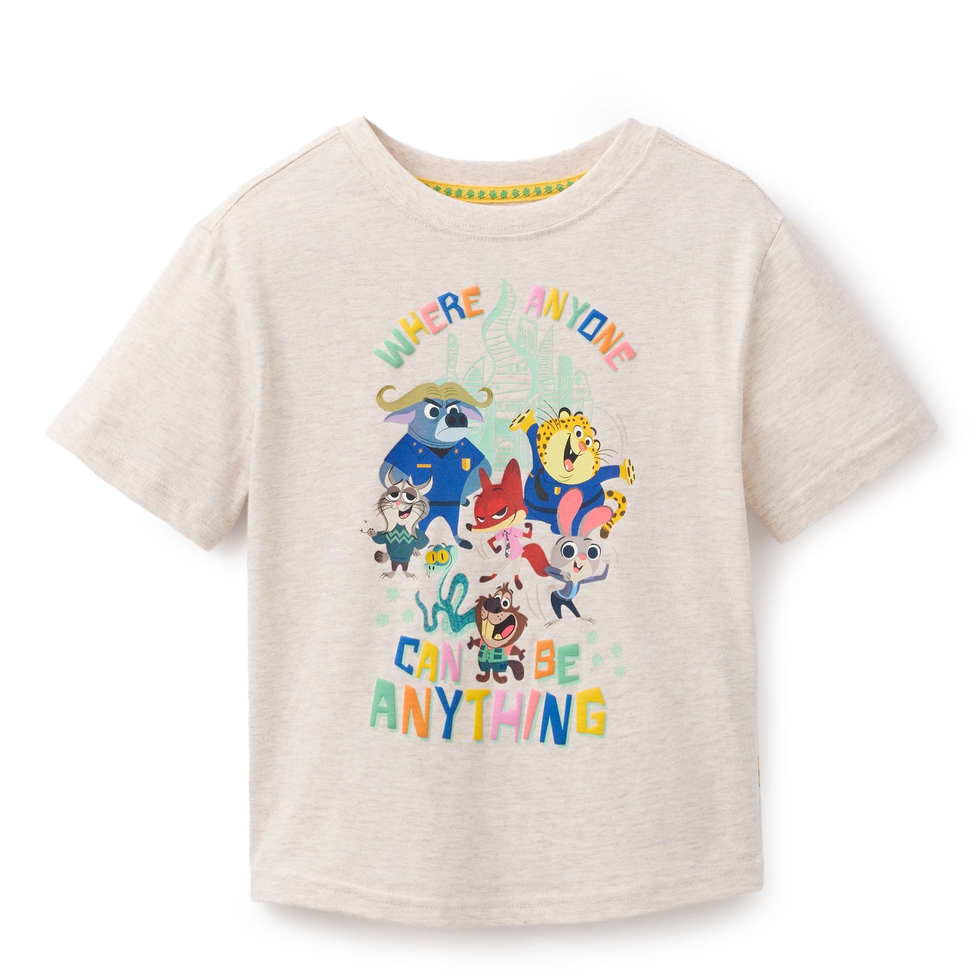 Beige kids' tee with vibrant, Zootopia 2-style animals, echoing Disney Store magic seen near Disneyland Park's Sleeping Beauty Castle.