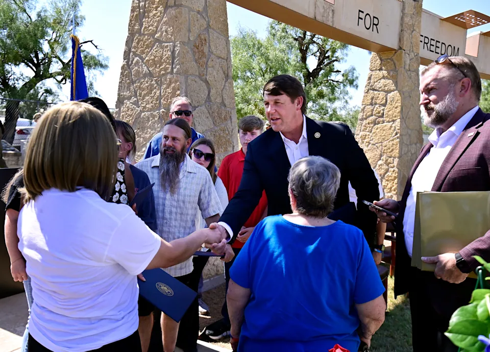 U.S. Rep. Jodey Arrington, R-Lubbock, meets with family members at a memorial for the TORQE 62 aircrew at Dyess Memorial Park Oct. 2. Arrington will be on the March 3, 2026, Republican primary ballot.