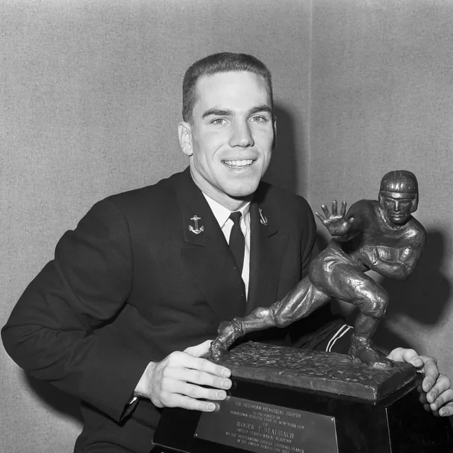 Navy quarterback Roger Staubach wins the Heisman Memorial Trophy in 1963. Staubach did a tour of duty in Vietnam before joining the Dallas Cowboys in 1969.