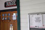 At the front door of the Rogue Pier 39 Public House, a sign seen on Monday Nov. 17, 2025 indicates the business is 