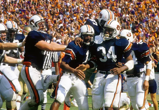 Oct 12, 1985; Auburn, AL, USA; FILE PHOTO; Auburn Tigers running back Bo Jackson (34) celebrates with his teammates on the sideline against the Florida State Seminoles at Jordan Hare Stadium. Mandatory Credit: Manny Rubio-USA TODAY Sports
