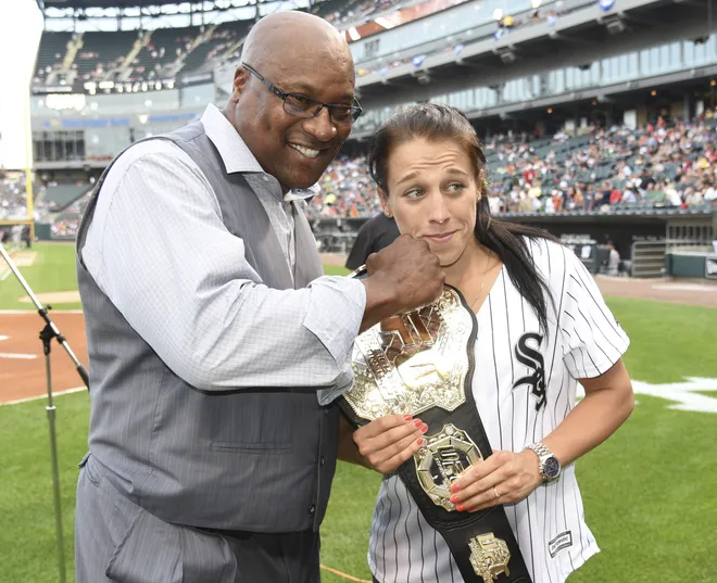 Jul 21, 2016; Chicago, IL, USA; Former MLB and NFL player Bo Jackson and UFC champion Joanna Jedrzejczyk fool around before throwing out the ceremonial first pitch before a game between the Chicago White Sox and the Detroit Tigers at U.S. Cellular Field. Mandatory Credit: David Banks-USA TODAY Sports