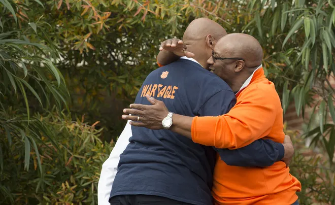 Bo Jackson, right, embraces Charles Barkley during the unveiling of the Charles Barkley Statue before the Iron Bowl NCAA football game between Auburn and Alabama on Saturday, Nov. 25, 2017, in Auburn, Ala.